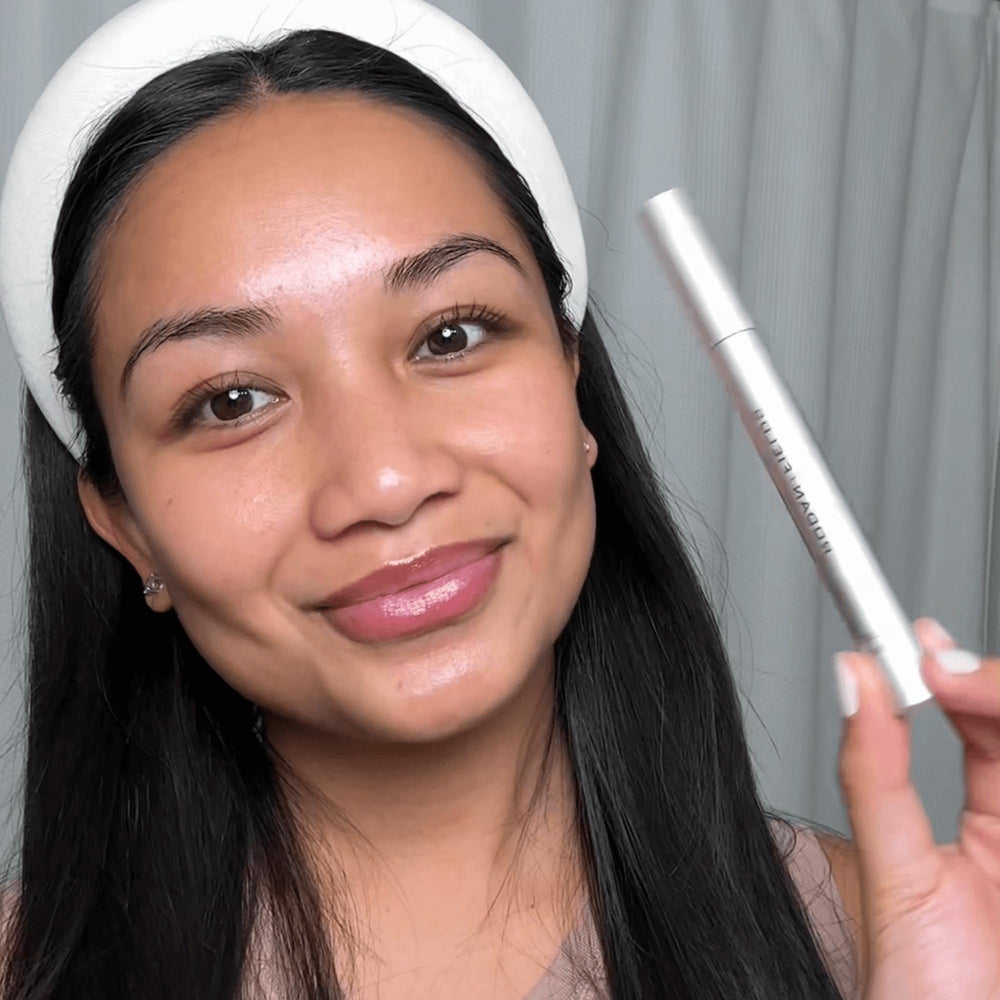 Rodan + Fields applied along upper lash line during nighttime routine for fuller look