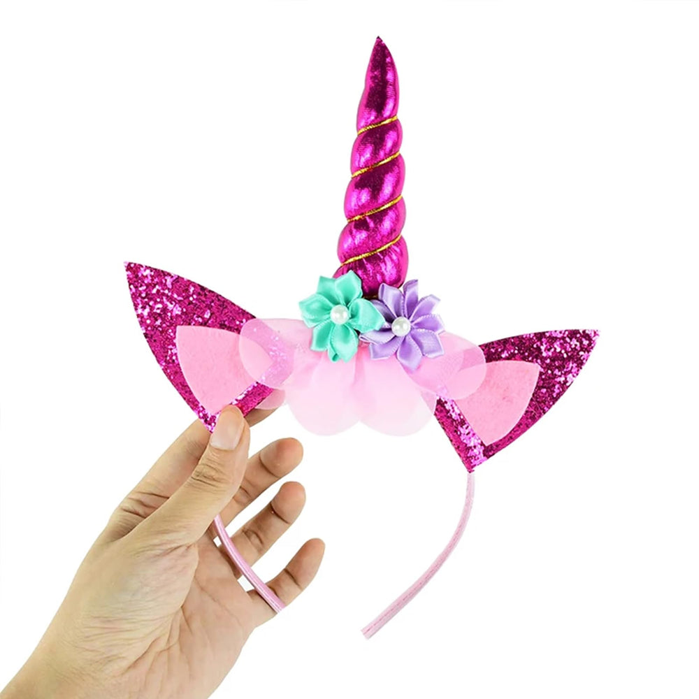 Roffiy headband in hand for scale, shows size and wearable portability