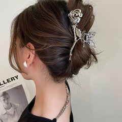 ROMODIYA silver rose in use holding a low bun for comfortable all-day wear