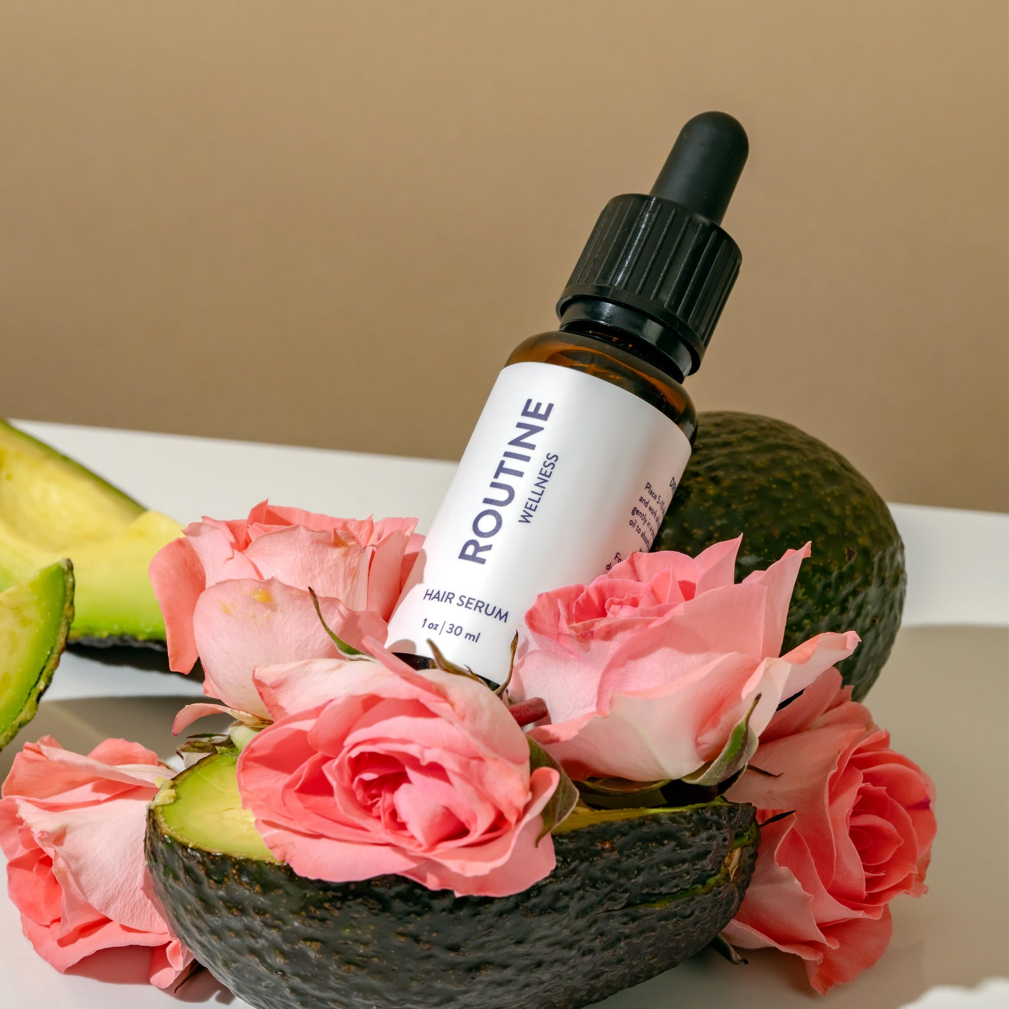 Routine Wellness bottle beside towel and brush in bathroom, suggests daily routine benefit