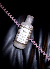 Model using R+Co Ring Tone to define curls showing enhanced shape and shine