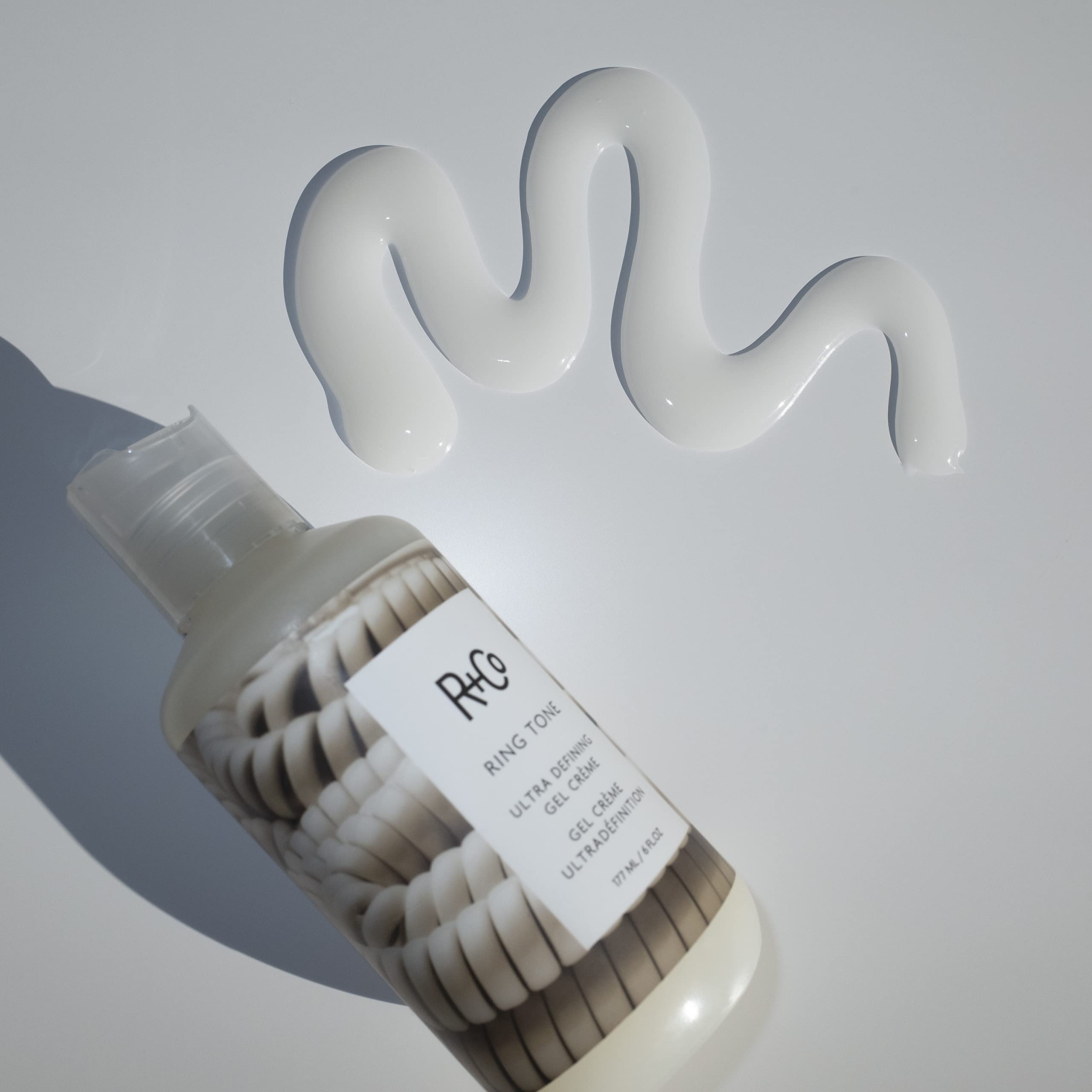 Lifestyle scene with R+Co Ring Tone and citrus elements reflecting fresh scent