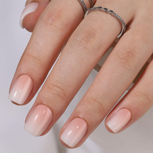 RPNZL close-up of peach ombre French tip texture for glossy finish