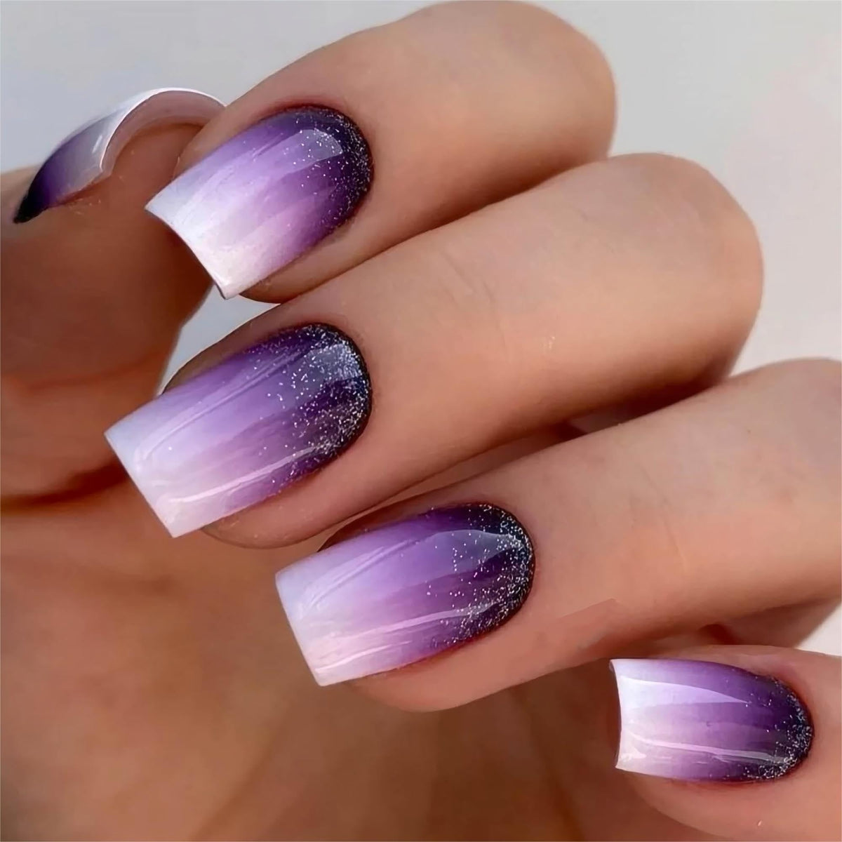 RTKHFZE front view of purple ombre square press-on nails showing glossy finish and design benefit