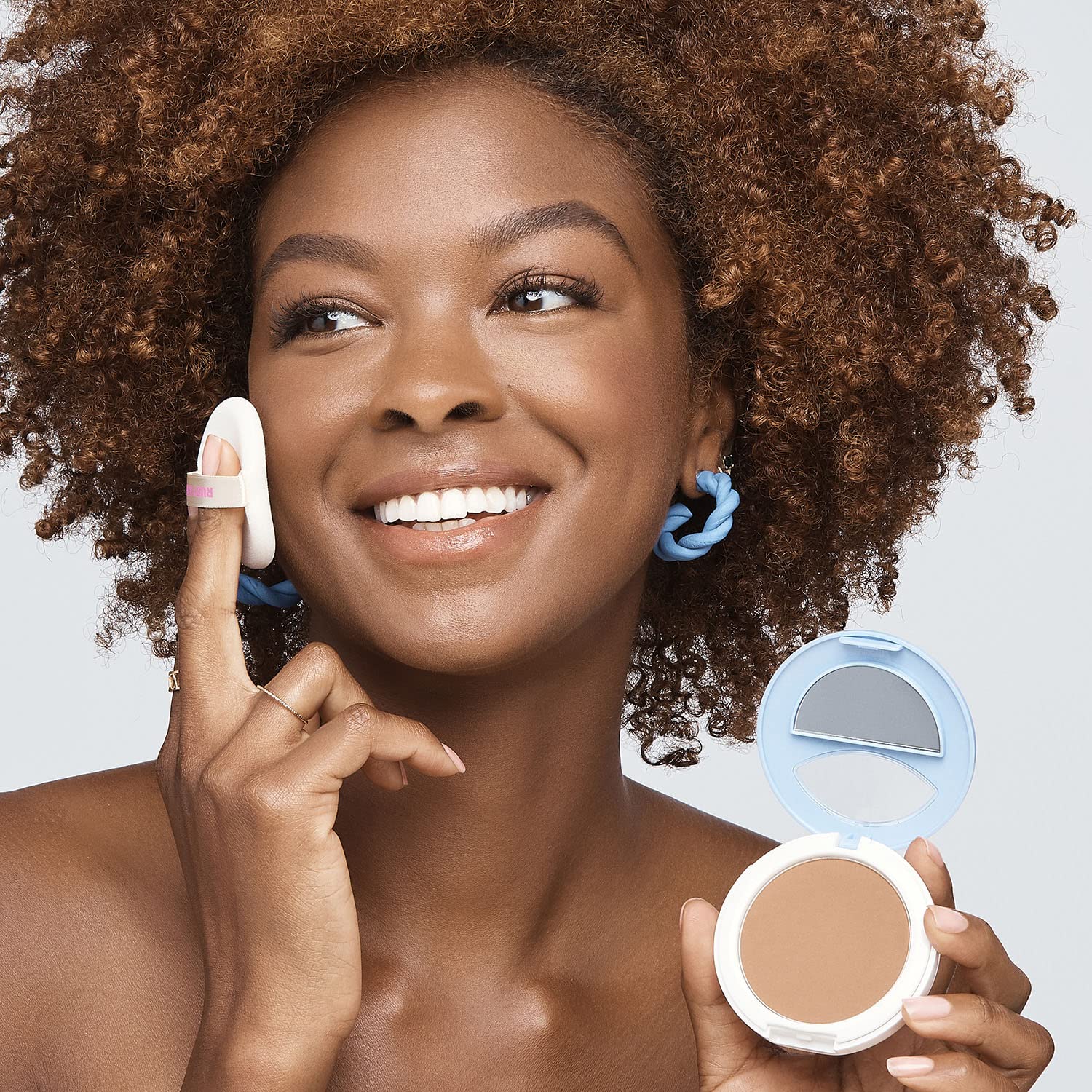 Ruby Kisses compact with puff demonstrating easy touch-up and controlled application