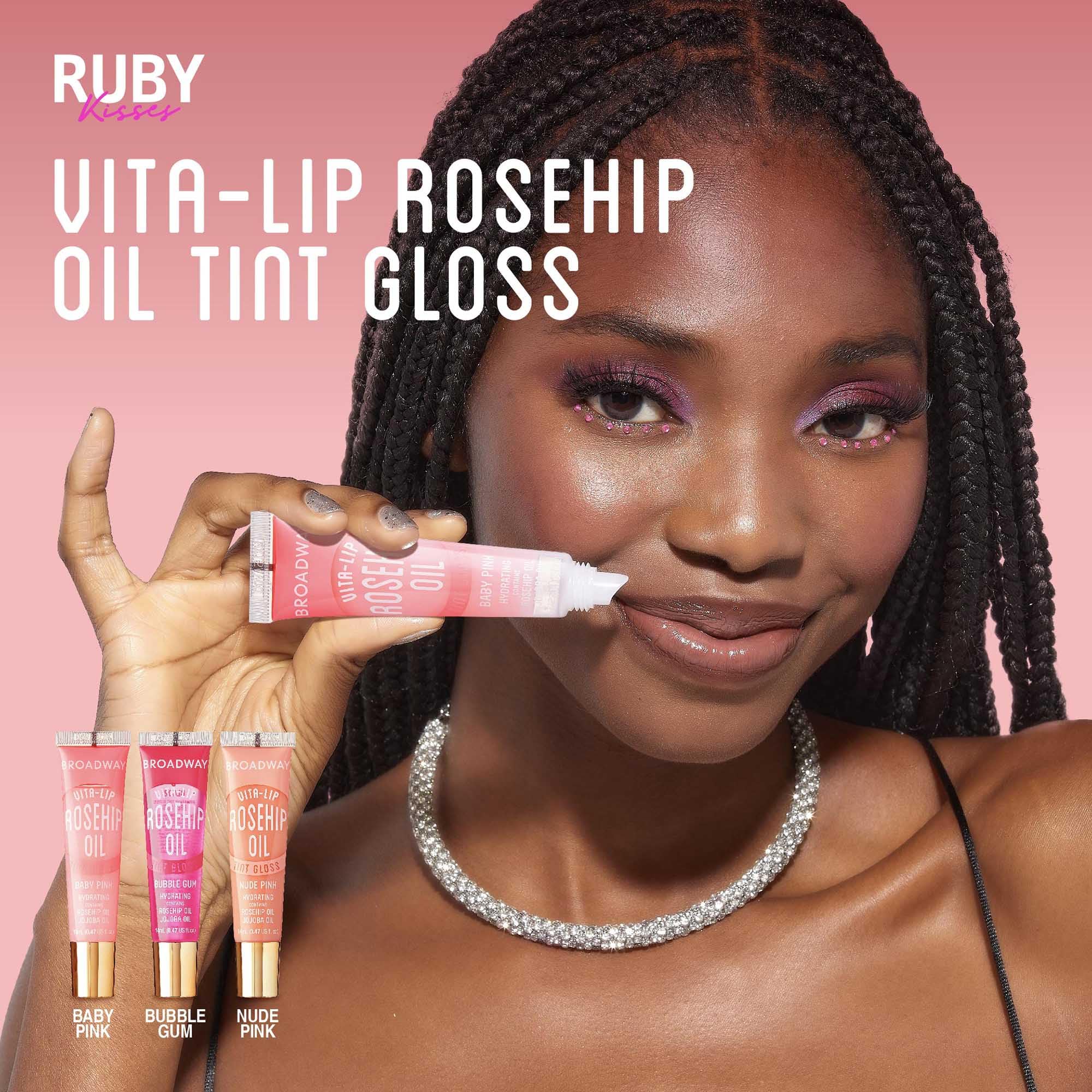 Ruby Kisses size comparison next to coin showing compact travel-friendly tubes
