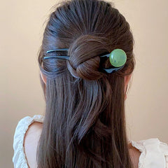 RUIYDZ pins securing a low bun for reliable hold during daily wear