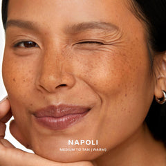 Saie swatch on arm Napoli medium–tan demonstrating buildable warm color