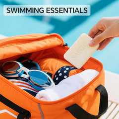 SAISZE pack of two bars staged in a swim bag for easy post-swim cleanup