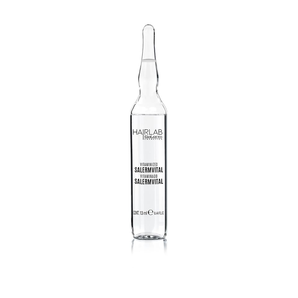SALERM Vitaminado hand applying drops to hair ends for soft, protected strands