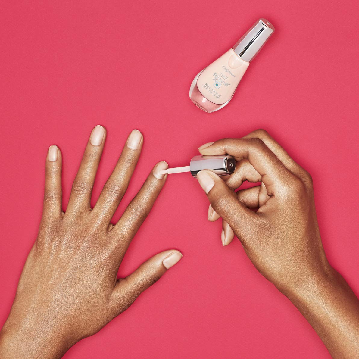 Sally Hansen base coat under colored polish for added nail defense