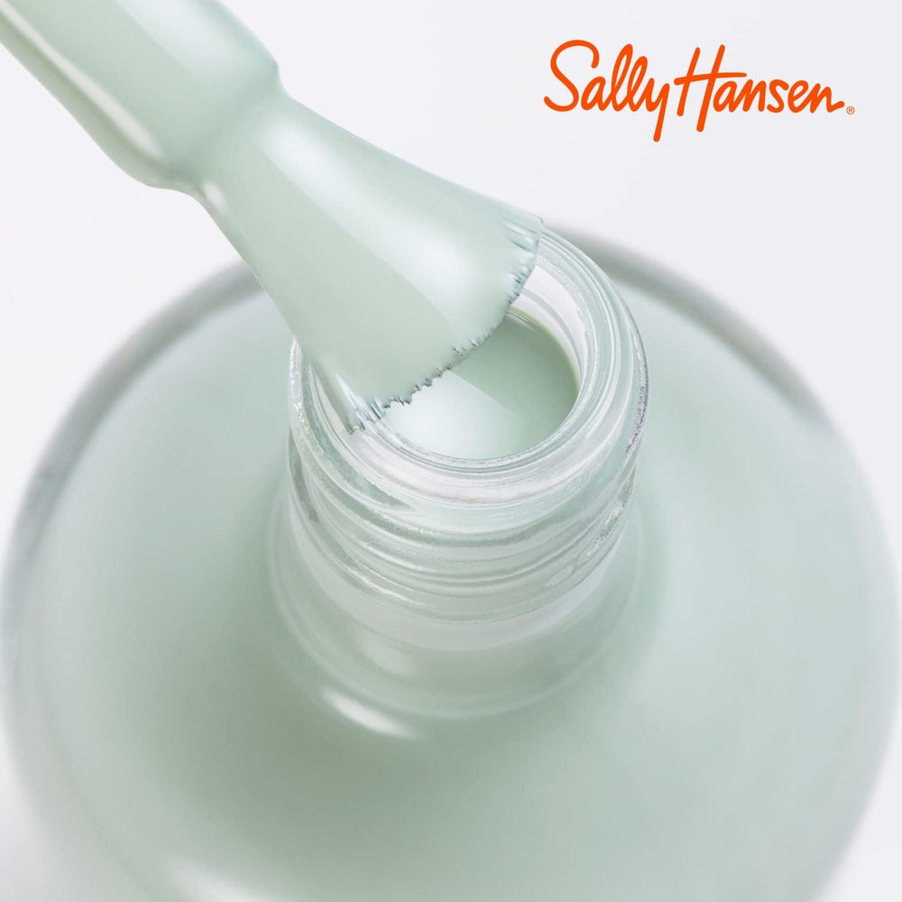 Sally Hansen polish held in hand indicating bottle size and ease of use