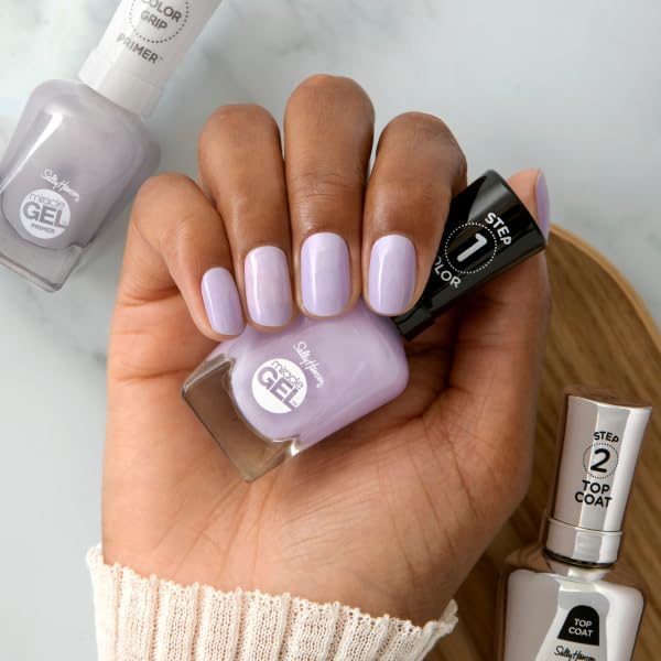 sally hansen bottle beside ruler indicating compact size and travel-friendly benefit
