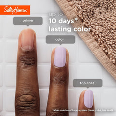Hand applying Sally Hansen Color Grip primer for longer-lasting polish