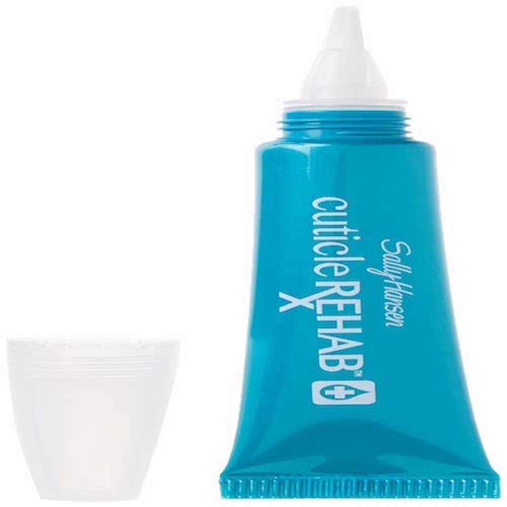 Applying Sally Hansen Cuticle Rehab with brush applicator to a nail cuticle for quick hydration