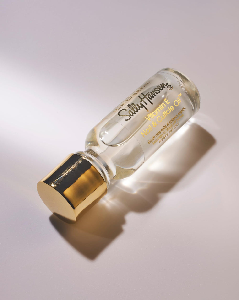 Sally Hansen drop on cuticle close-up for targeted conditioning
