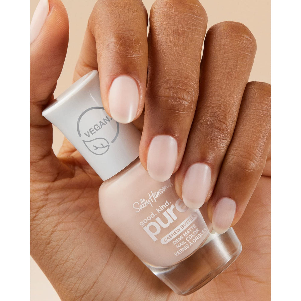 Bamboo stalk and marine algae next to Sally Hansen top coat highlighting natural ingredients