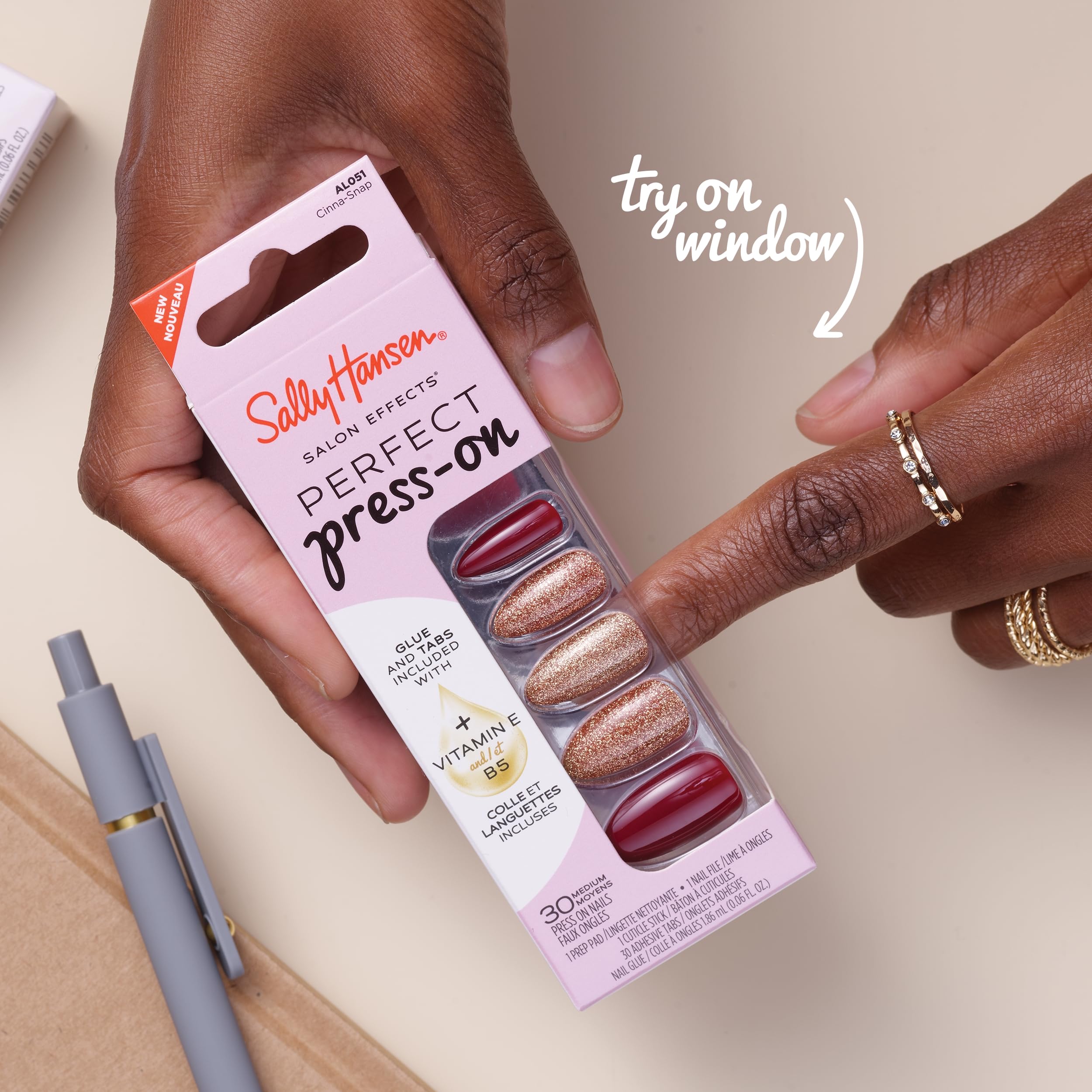 Hand applying Sally Hansen press-on nails demonstrating quick, salon-quality at-home application