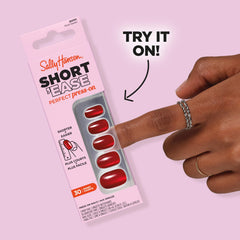 Sally Hansen nail file and tools arranged for customizing nail fit and edge smoothing