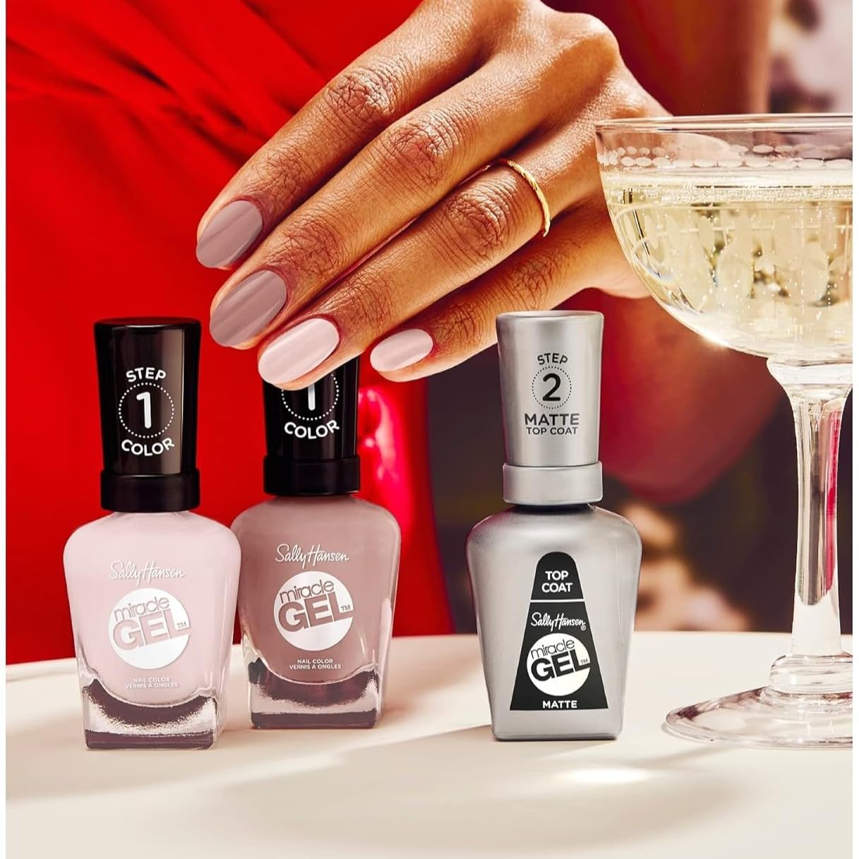 Sally Hansen polish beside common objects to show true bottle size