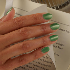 Sally Hansen holiday manicure on hands conveying festive, long-lasting shine