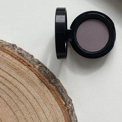 Sandstone Scandinavia size comparison next to coin showing compact scale for travel