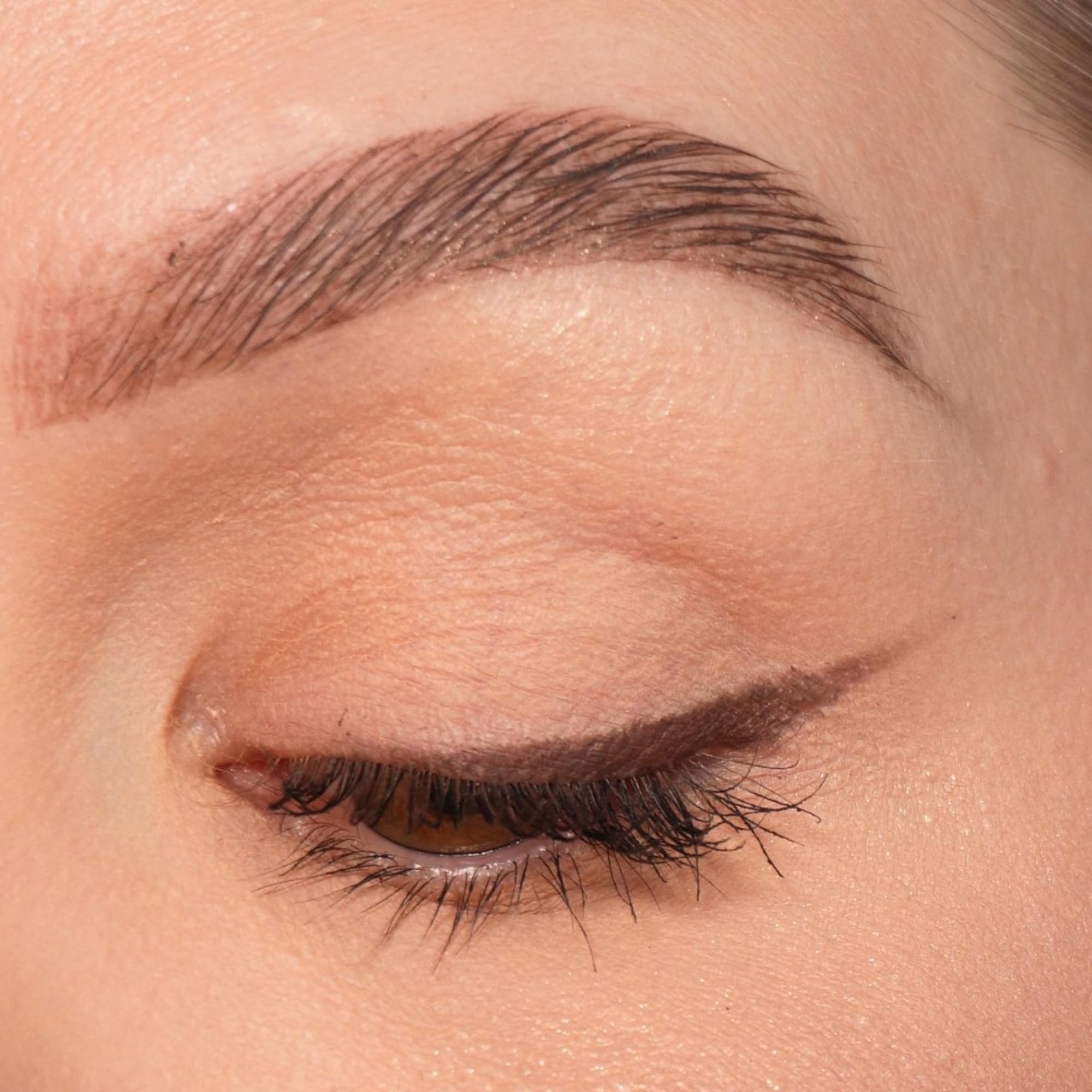 Sandstone Scandinavia eyeliner texture stroke on skin demonstrating smooth, buildable brown color
