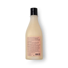 SAUCE BEAUTY 10 fl oz bottle held in hand showing compact travel size