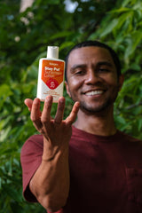 Person using Sawyer sunscreen in outdoors illustrating durable protection