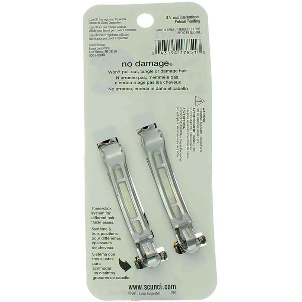 Scunci barrette beside a coin showing compact size and easy portability advantage