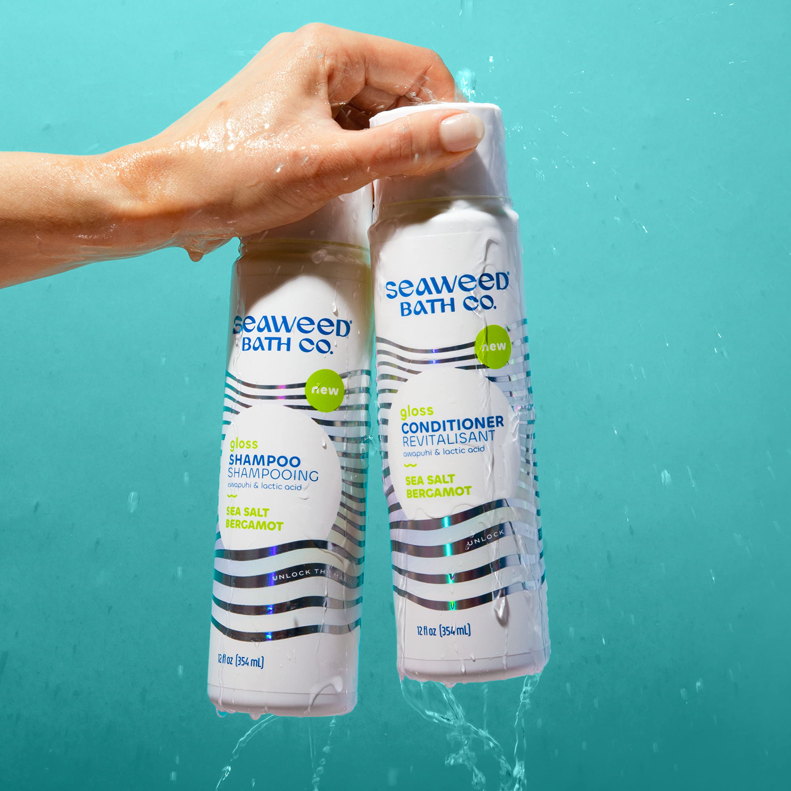 Seaweed Bath Co. 12 oz bottle in hand to show scale and travel-friendly convenience
