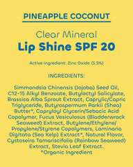 Seaweed Bath Co. lip shine on a towel at the beach suggesting outdoor sun protection