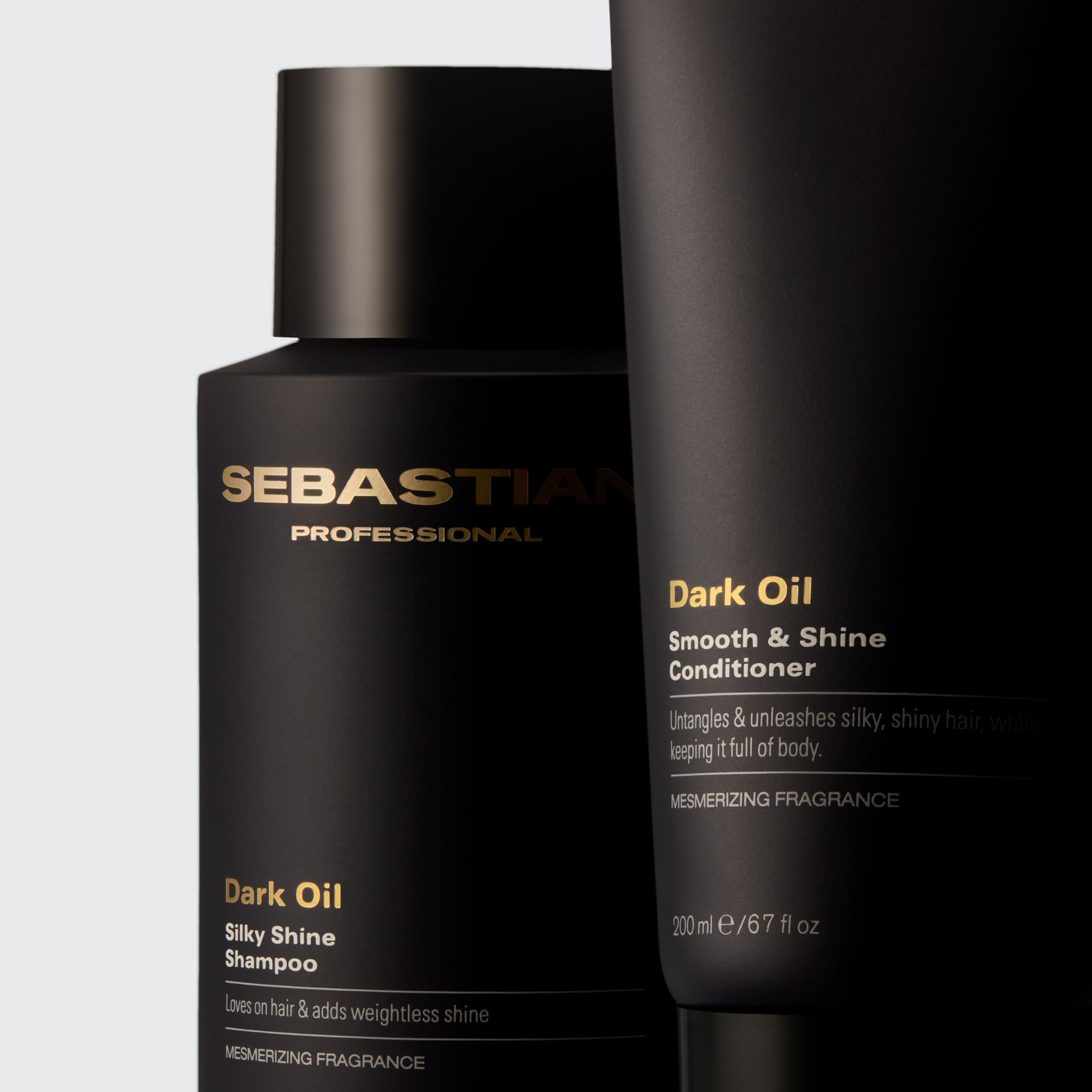 Sebastian Dark Oil next to hand for size comparison and travel convenience benefit