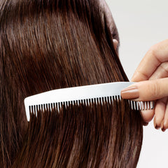 Sebastian before and after hair strand showing reduced frizz and softness