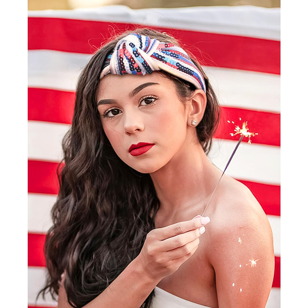 SeBneny headband beside hand showing scale and one-size-stretches-to-fit