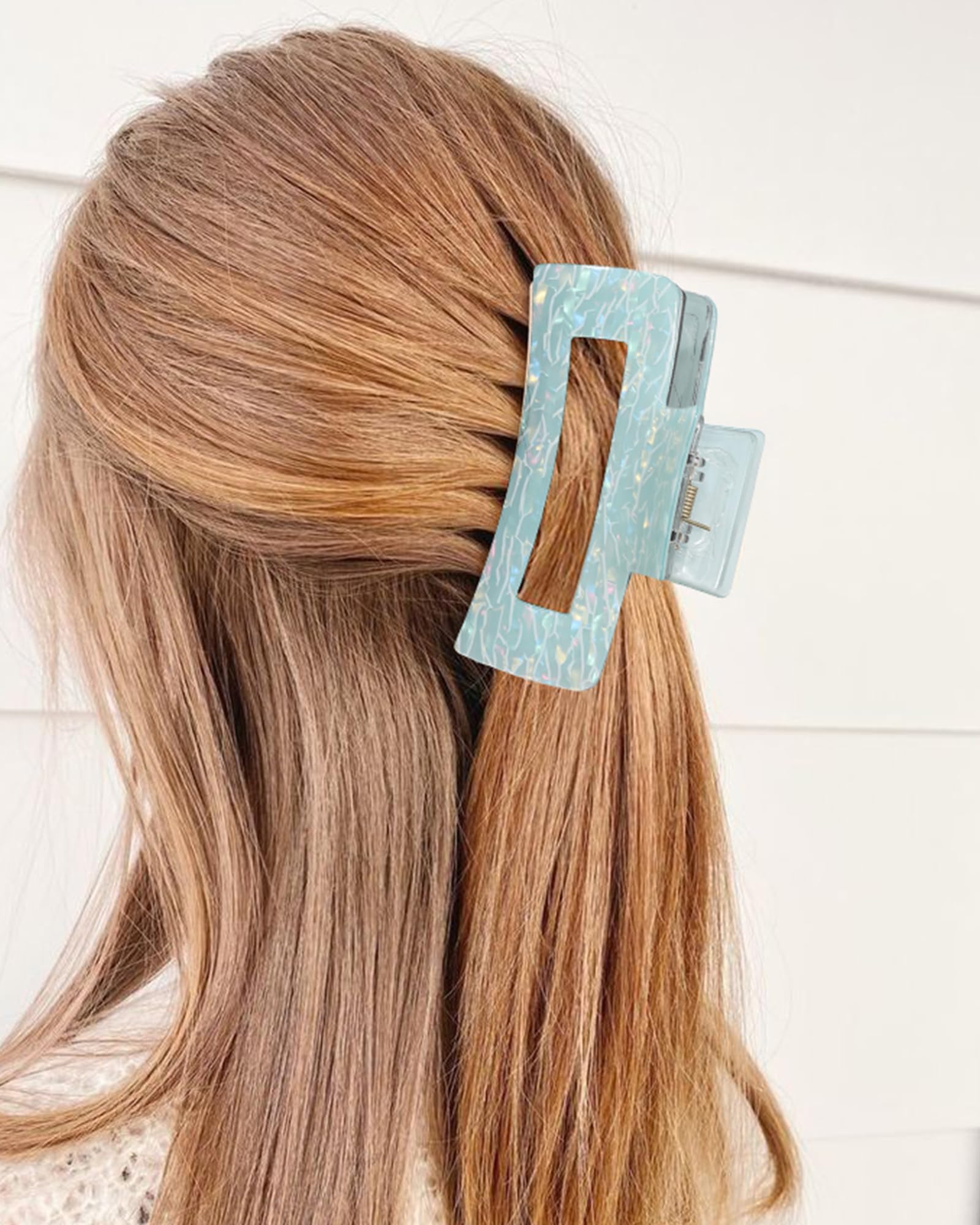 Secroma styled half-up look on model showing fashion-forward, secure hold