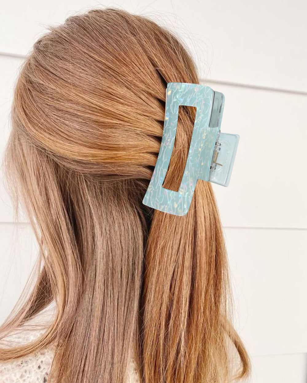 Secroma styled half-up look on model showing fashion-forward, secure hold
