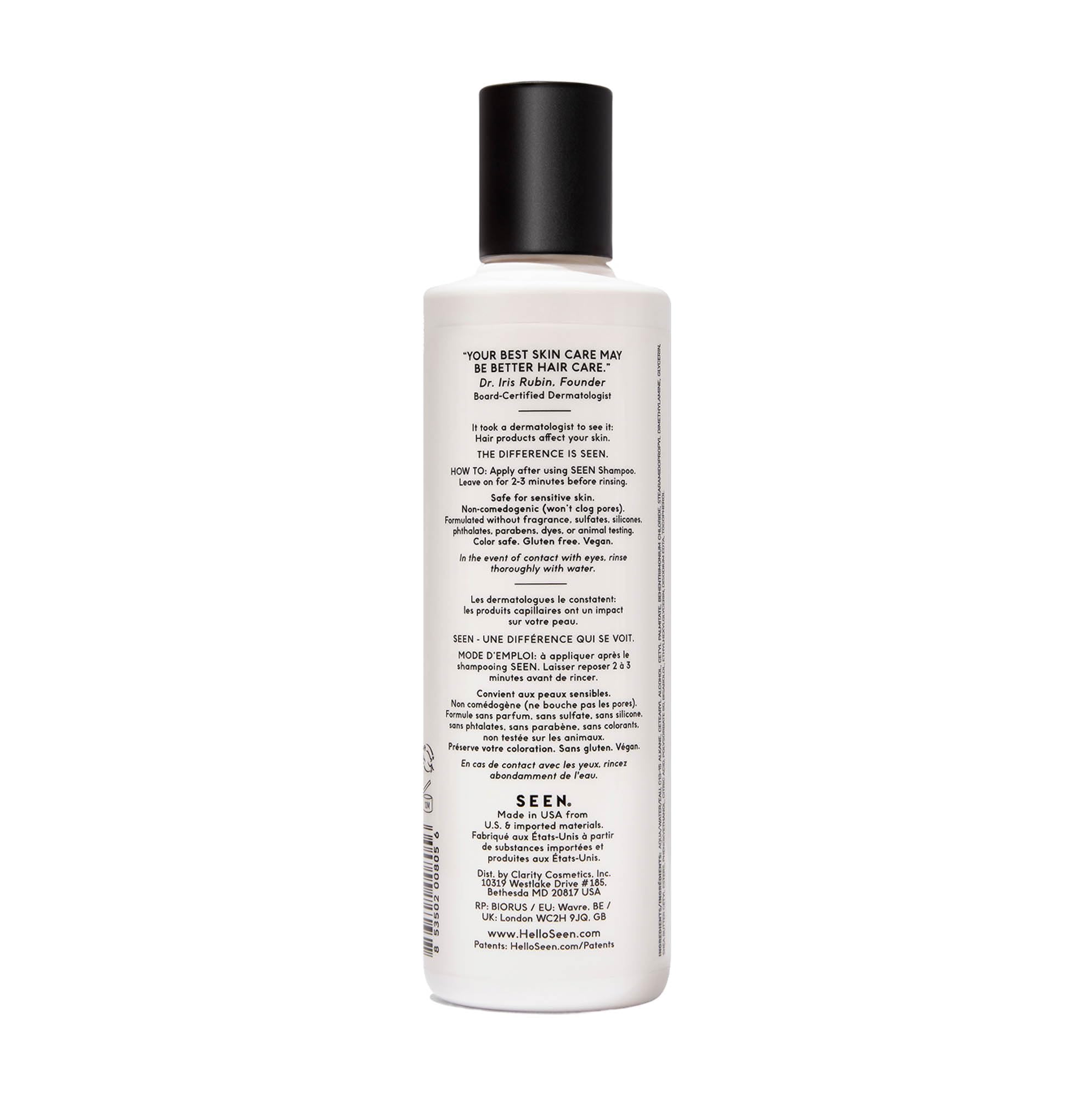SEEN conditioner creamy texture on fingertips demonstrating lightweight spreadability