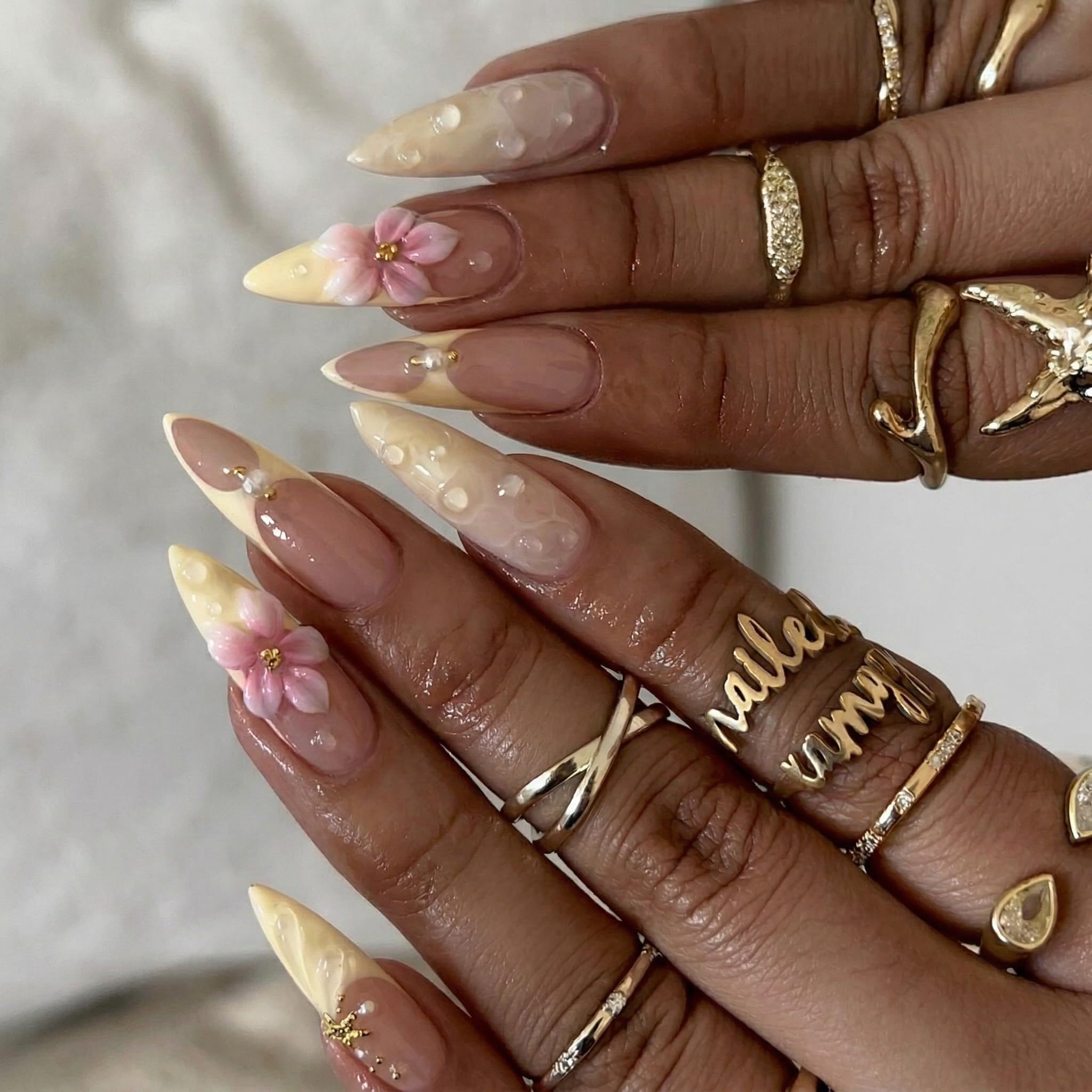 SEENEEY close-up of pink floral accent nail revealing fine artwork and feminine appeal