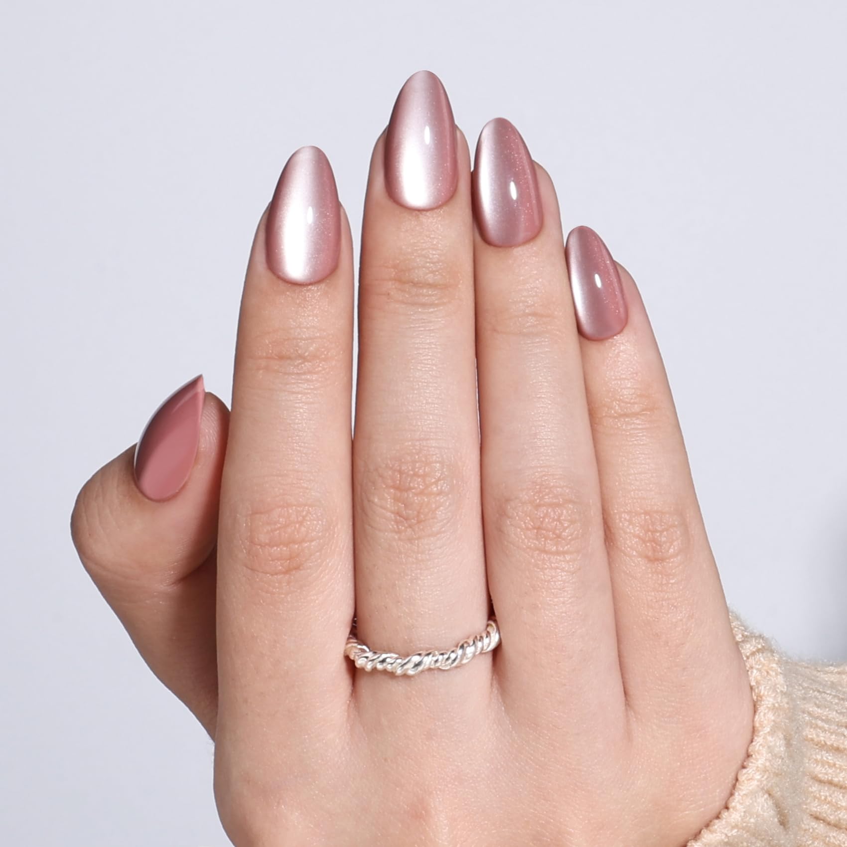 SEEWEE nail placed next to finger to show true-to-scale fit