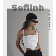 Sefiinh headband held in hand indicating size and one-size-fits-most fit