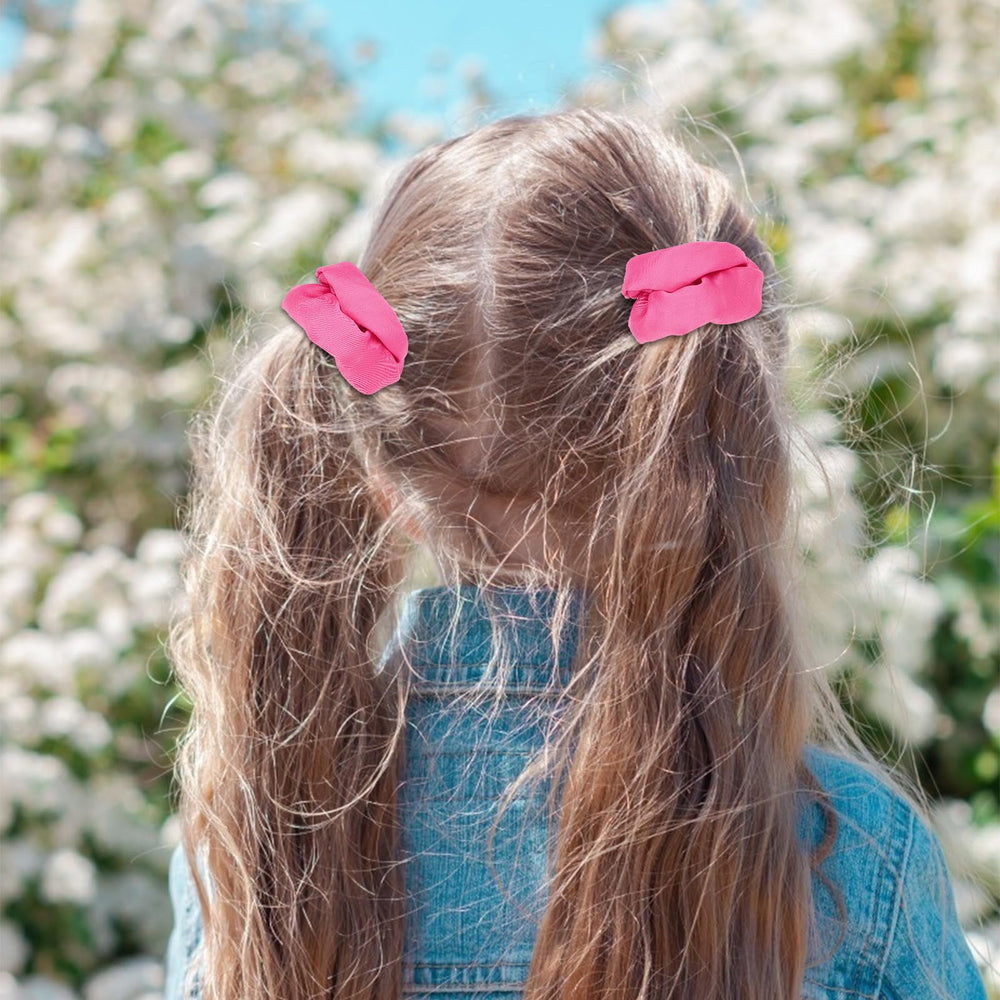 Semato hot pink scrunchie worn in ponytail on model demonstrating comfortable hold