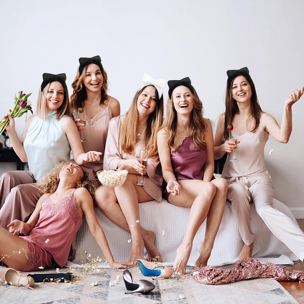 Semato bride and bridesmaids wearing headbands in a prep setting for coordinated photos