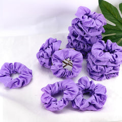 Semato single scrunchie on flat surface highlighting shape and sheen