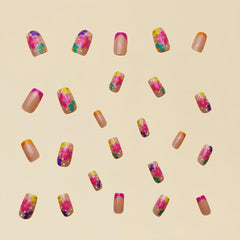 Sevgob side view of pink-orange French tips showing vibrant gradient