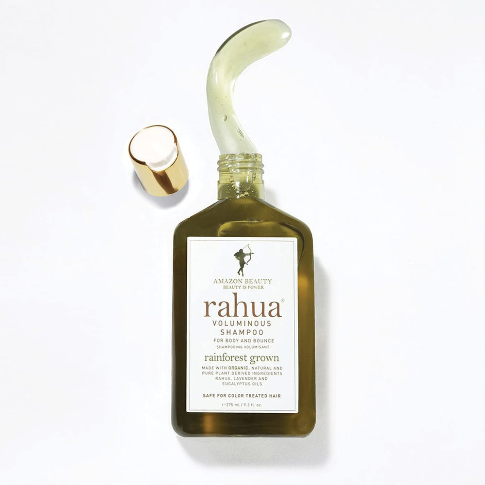 Wet hair being massaged with Rahua shampoo showing effective buildup removal