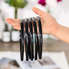 Shappy headband next to ruler showing 10 mm width for low-profile fit