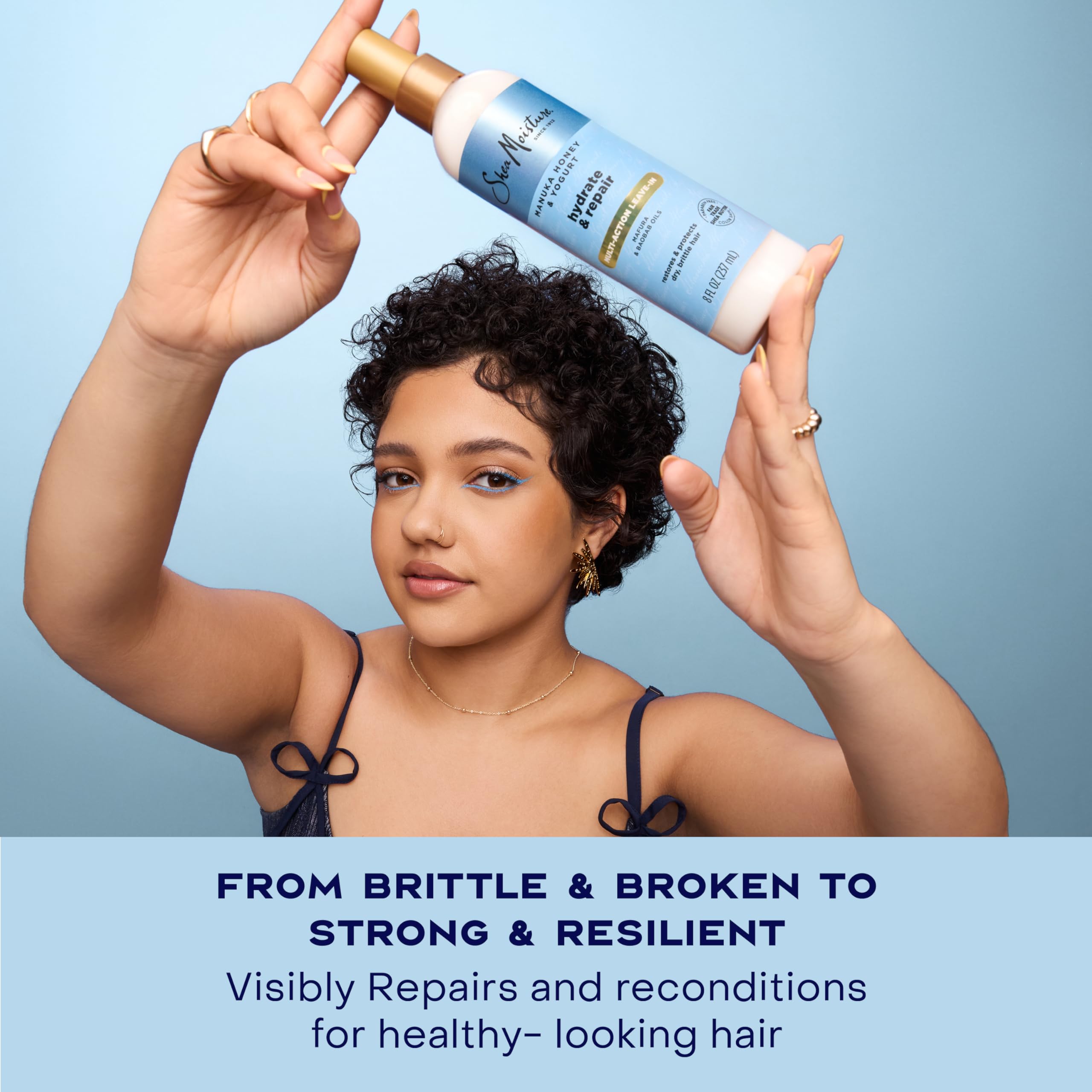 Shea Moisture spray being applied to damp hair for easier detangling