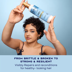 Shea Moisture spray being applied to damp hair for easier detangling