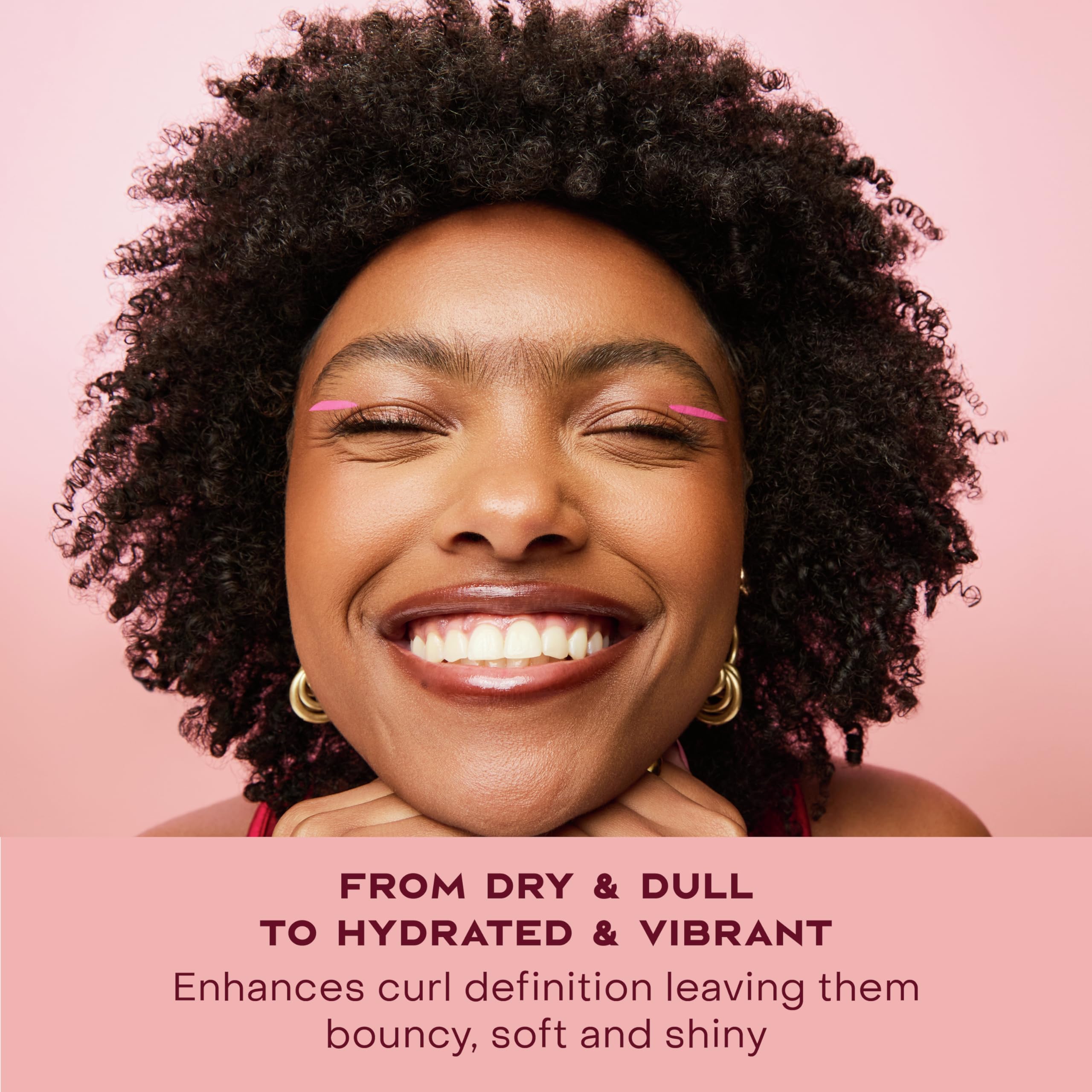 SheaMoisture being applied to damp hair in sections demonstrating controlled styling and frizz reduction